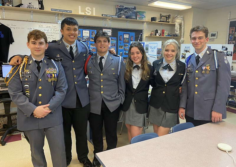 La Salle Institute students pose in their cadet uniforms in a classroom